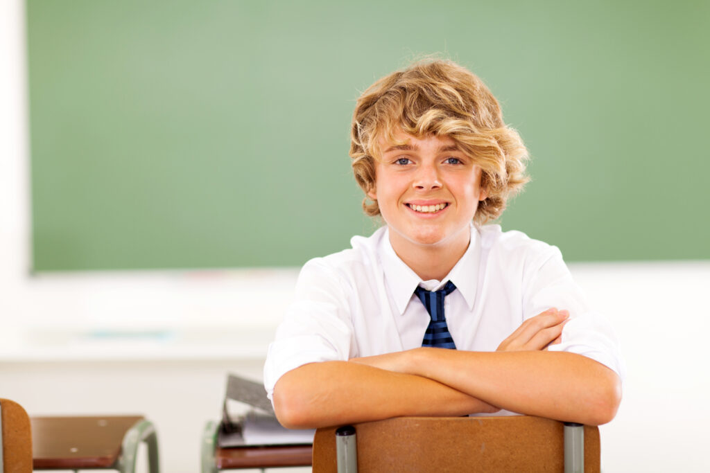 Cute,High,School,Student,Sitting,In,Classroom