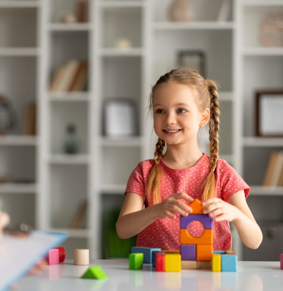 Child,Development,Specialist,Lady,Having,Session,With,Cheerful,Little,Girl,